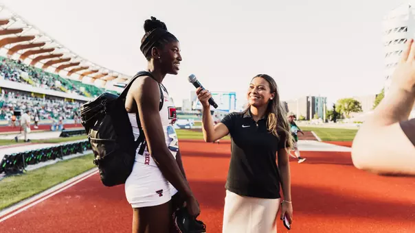 Temitope Adeshina taking an interview after winning the NCAA high jump title