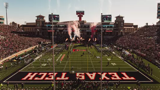 The Masked Rider runs down the middle of the field as smoke and fireworks go off in the background during Texas Tech's entrance prior to its 2025 win over UCF.