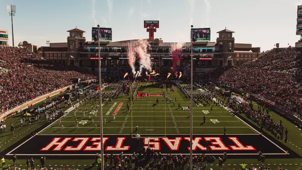 The Masked Rider runs down the middle of the field as smoke and fireworks go off in the background during Texas Tech's entrance prior to its 2025 win over UCF.