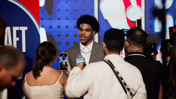 Christian Anderson talks with reporters at the 2026 NBA Draft.
