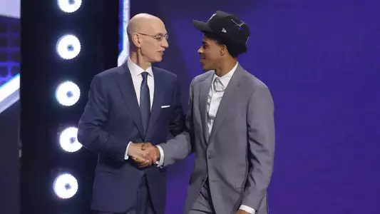 Christian Anderson is greeted by Adam Silver after being selected in the NBA Draft.