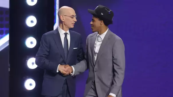Christian Anderson is greeted by Adam Silver after being selected in the NBA Draft.