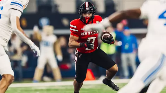 Cameron Dickey looks for a hole to run through during Texas Tech's victory over BYU in the 2025 Edward Jones Big 12 Championship.