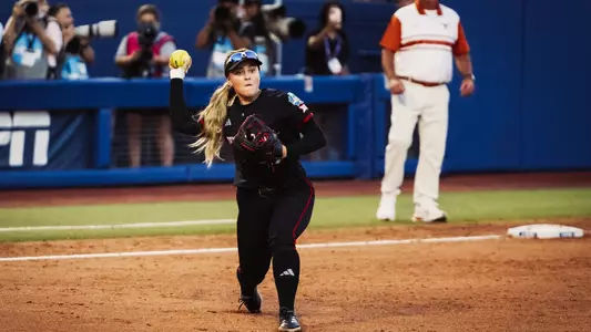 Taylor Pannell throws to first for an out against Texas in the Women's College World Series.