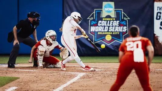Mihyia Davis hits a single against Texas in the Women's College World Series.