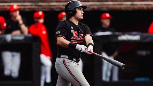 Caden Ferraro stands and admires a home run during the Red Raiders contest at Cincinnati