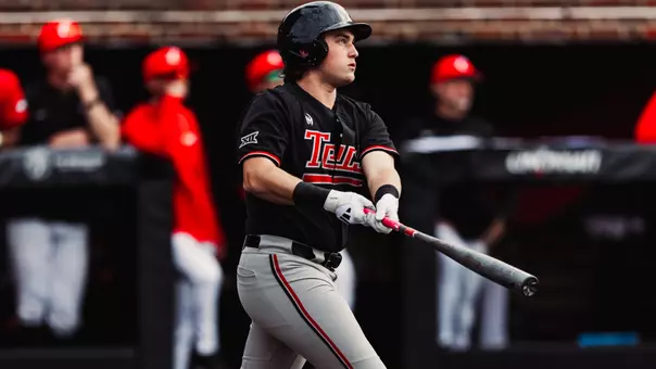 Caden Ferraro stands and admires a home run during the Red Raiders contest at Cincinnati