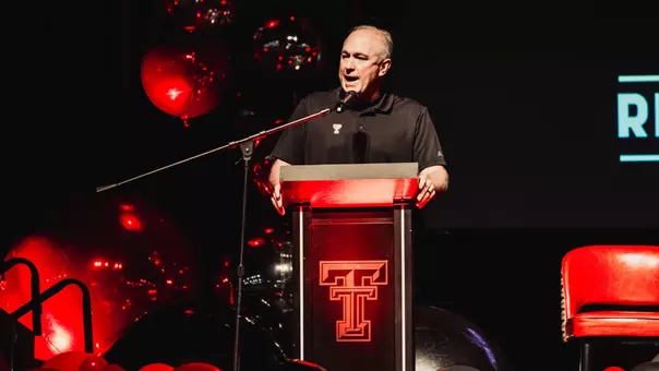 Joey McGuire speaks to a capacity crowd during the 2025 Red Raider Club Kickoff Luncheon.