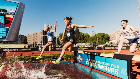 Lily Mather jumping over the water barrier