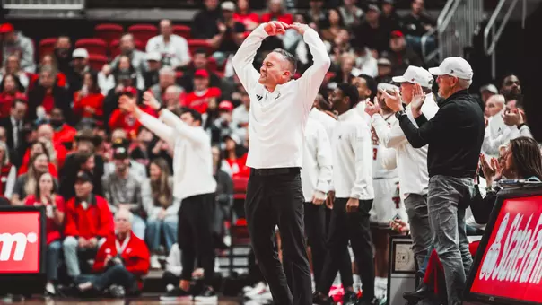 Grant McCasland celebrates during a game on the court.