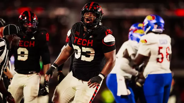 A.J. Holmes Jr. celebrates following a tackle for loss during Texas Tech's 2025 victory over Kansas.