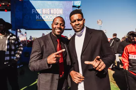 Antonio Huffman and Michae Crabtree posing at Big Noon Kickoff