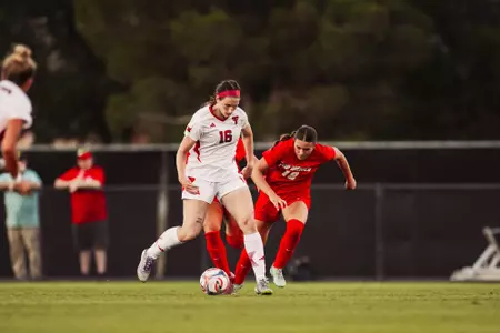 Taylor Zdrojewski muscles past a UNM defender during an Aug. 7 exhibition vs. the Lobos
