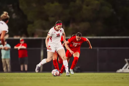 Taylor Zdrojewski muscles past a UNM defender during an Aug. 7 exhibition vs. the Lobos