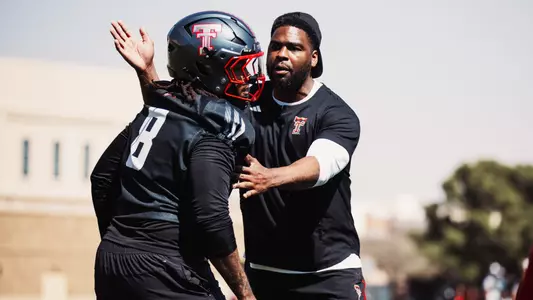 Jacquies Smith working with Jamond Mathis at Texas Tech fall camp