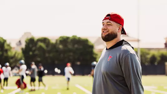Cole Maxwell standing on the right side of the frame during a Texas Tech Football practice session