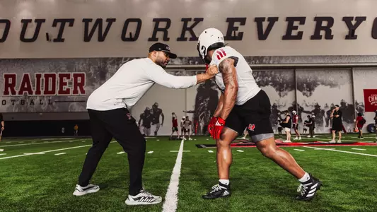 Justin Johnson working with a receiver during fall camp