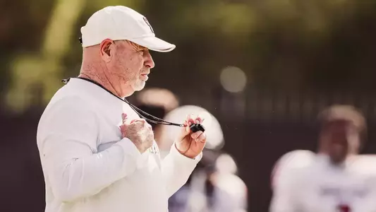 Kenny Perry adjusting his whistle at fall camp
