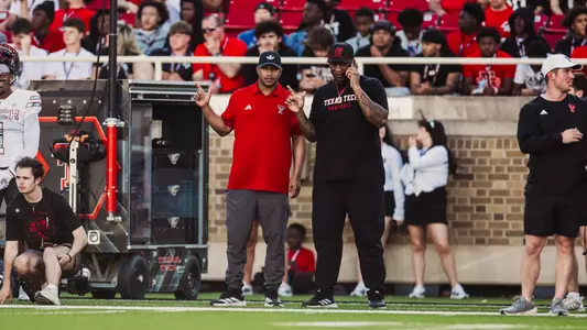 Brian Nance and Chase Adams on the sidelines of the Texas Tech spring game