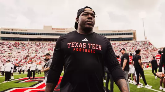 Taylor Young walking off the field after a Texas Tech football game