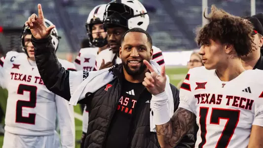 James Blanchard with some players doing the matador song after a win