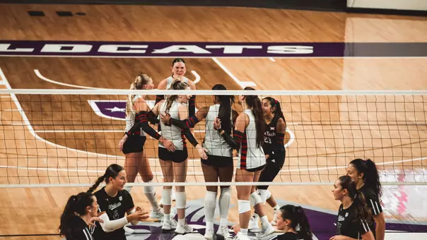 Texas Tech's volleyball team huddles up following a point against ACU