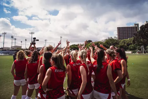 The Red Raiders huddle up with their guns up prior to the game against Hawaii