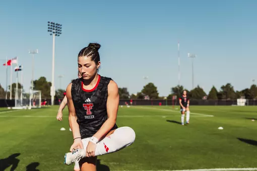 Emma Torres stretches prior to the Red Raiders contest against New Mexico