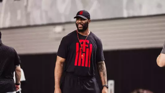 Alex Watkins standing in the middle of the frame during a Football practice session