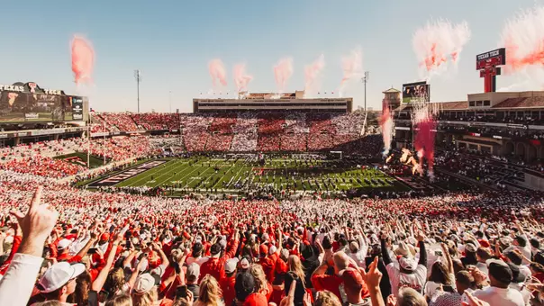 Scenic shot of Galaxy Stadium prior to the 2025 home game versus BYU where the stands are stripped out in red and white with fireworks launching red during the team entrance.