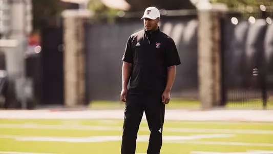 Chase Adams standing on the outdoor football practice field