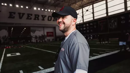 Steven Lapso at the middle of the frame during football practice