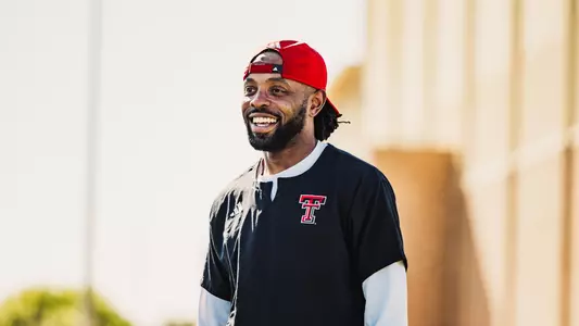 Freddie Johnson smiling during outdoor footbal practice