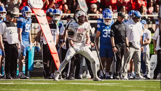 John Curry yells in excitement after a big play on the opposite sideline in Texas Tech's 2025 victory over BYU at home.