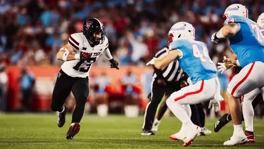Ben Roberts rushes the line of scrimmage against a Houston running back during Texas Tech's 2025 victory.