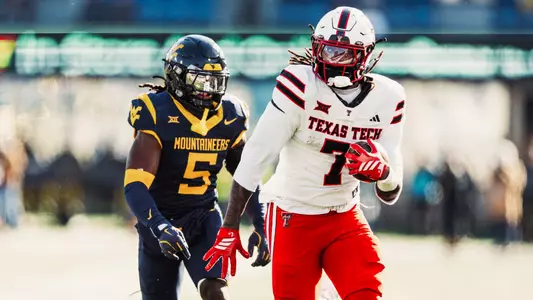 Terrance Carter Jr. outruns a West Virginia defender after catching a pass in Texas Tech's shutout victory over the Mountaineers in 2025.