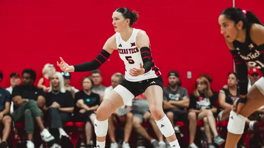 Elia Dinsmore preparing for for a serve during a Texas Tech volleyball match