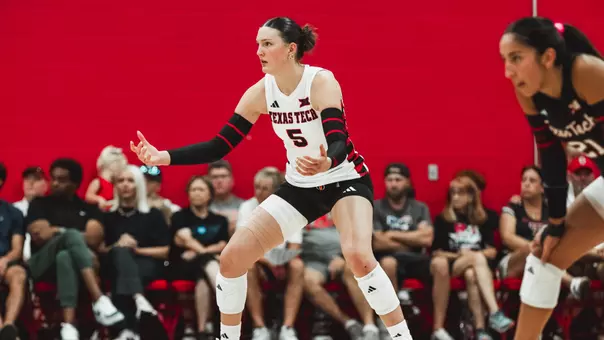 Elia Dinsmore preparing for for a serve during a Texas Tech volleyball match