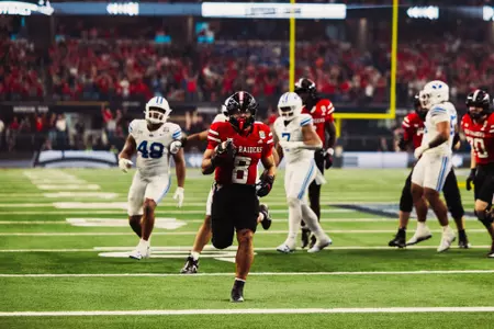 Cameron Dickey runs the ball into the endzone scoring on offense.