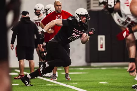 Trick making a huge burst against the offensive line.