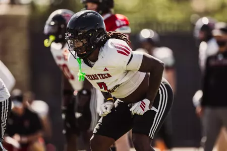 Grant prepares for a snap during a practice drill