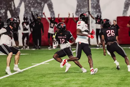 Tarrion Grant prepares to head downfield following an interception during a practice.