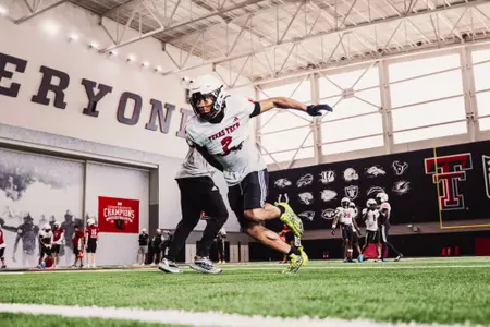 Johnson takes off to sprint downfield during a practice.