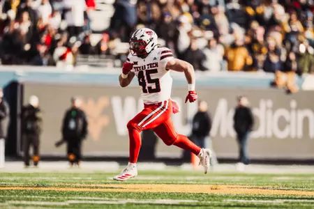 Golwas sprints downfield following a kickoff against West Virginia