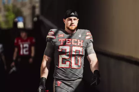 Adam Trick walking down the tunnel into the spring game.