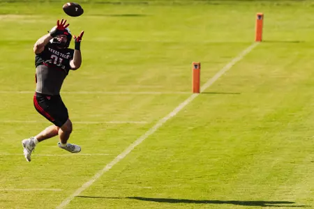Cord Nolan making a catch near the endzone.