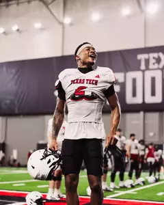 Kenny Johnson hypes up his teammates before practice begins.