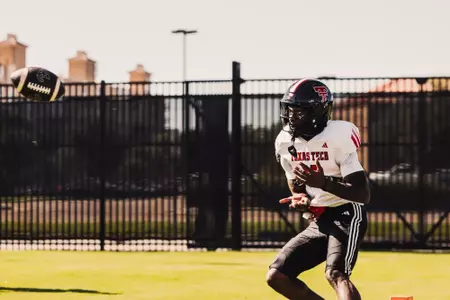Simmons prepares to receive a pass during a drill.