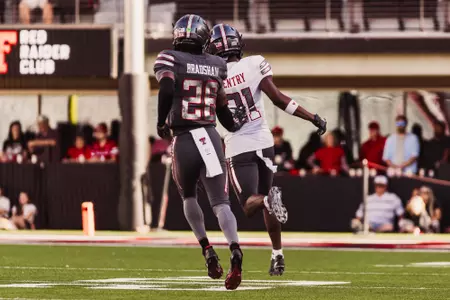 Bradshaw running after receiver.