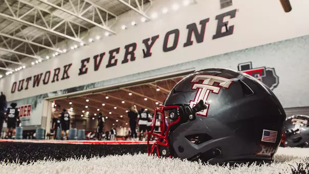 A grey Texas Tech helmet sits on the turf inside the Sports Performance Center during a Texas Tech preseason practice.